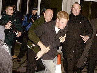 Prince Harry Tussles with Photographer
