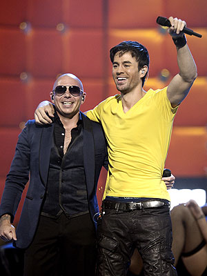 Pitbull, Marc Anthony Stand Out at Rain-Drenched Latin Grammys