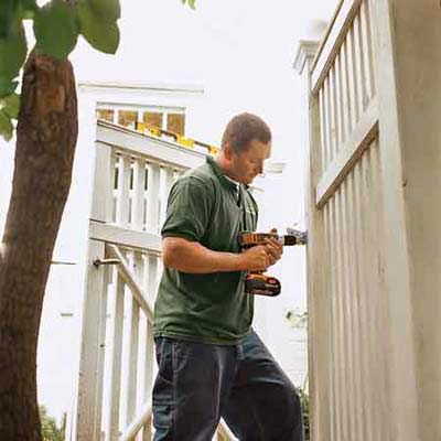 man standing with power drill