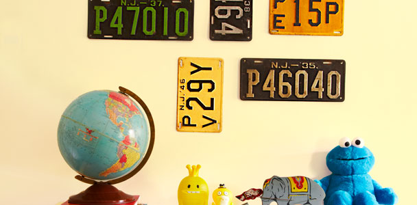 collection of license plates hung on wall