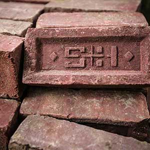 pile of Stiles and Hart Brick Company bricks