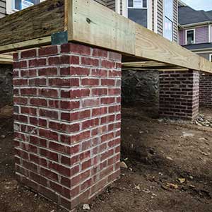 victorian house with back porch under construction made with period perfect Stiles and Hart Brick Company bricks