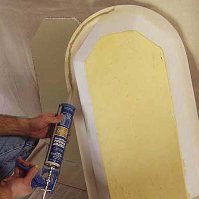 apply adhesive for preliminary install of niche into wall-opening