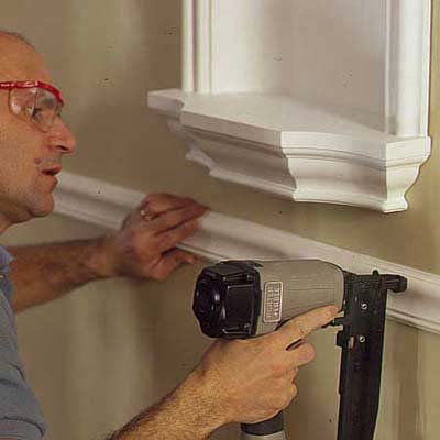 adding a decorative chair rail beneath the niche adds to the look
