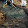 Adding crushed stone.