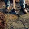 Compacting the stone base.