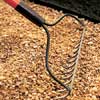 Filling the path with gravel.