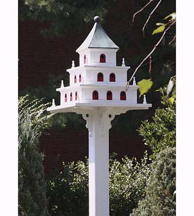 purple marlin birdhouse with scrollwork, patinated copper roof, and 24 doors