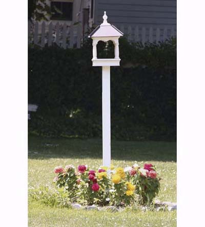 bandstand-style bird feeder with flower bed at base
