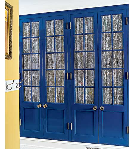 Pantry painted Paris-inspired blue with curtains