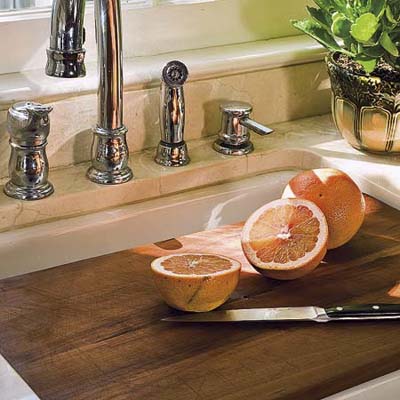 cherry wood cutting board in a remodeled 1850s cottage kitchen