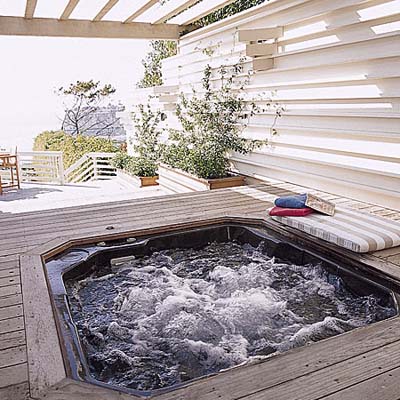 deck with a hot tub 