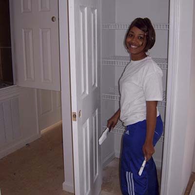 homeowner painting a kitchen pantry door