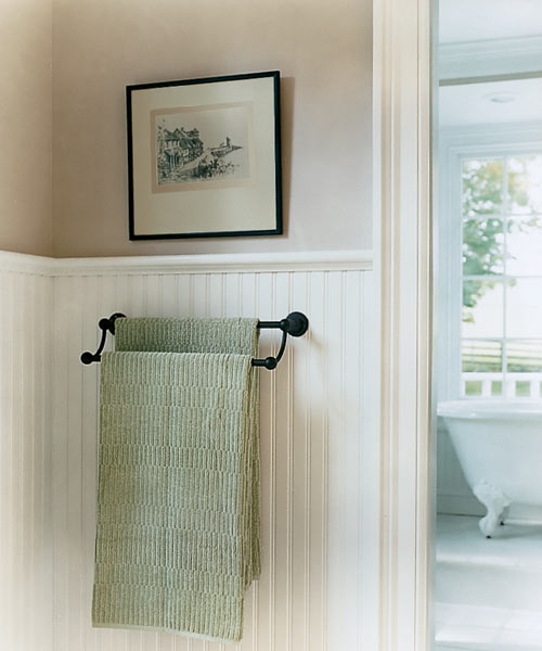 a light color scheme on wainscoting and walls
