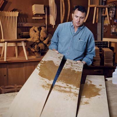 David Moser splashing naphtha on cherry wood to check its color