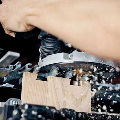 David Moser uses a router to create dovetail joints