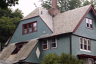 green exterior paint with white and red trimming