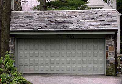 garage doors painted a mossy green