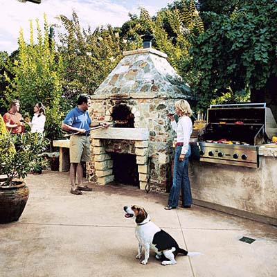 Pizza oven with custom hearth in outdoor kitchen