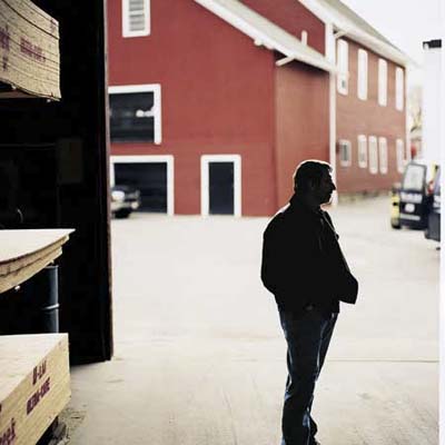 Norm Abram pauses to look around at lumberyard