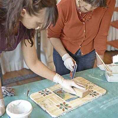 clean off the excess grout, seal and use your new table