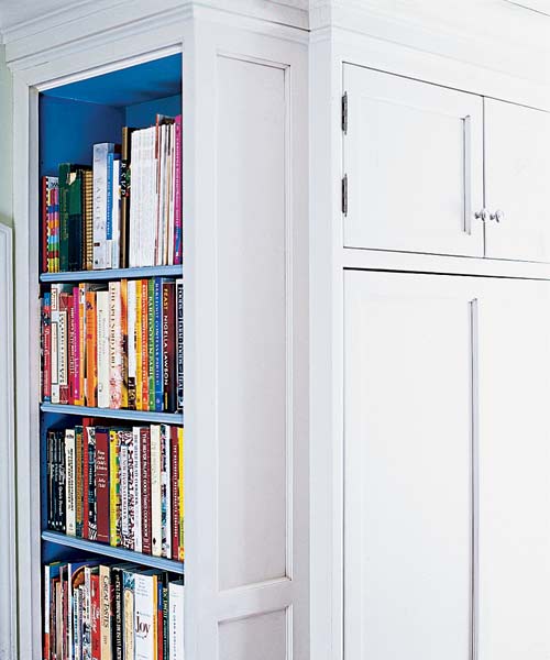 kitchen after remodel with built-in bookshelf to hold cookbooks