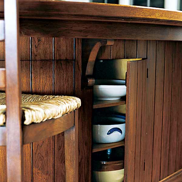 after kitchen remodel with beadboard on kitchen island with hidden built-in storage
