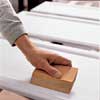 Sand the primer kitchen cabinet