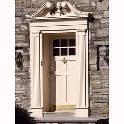 entryway with swan's neck & fluted pilasters