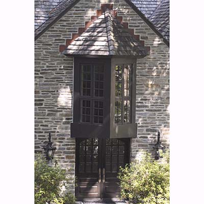two-sided bay window & steeply arched gable entryway