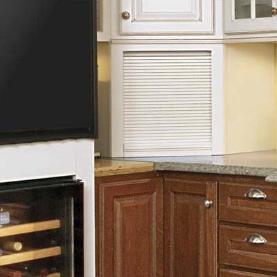 by adding a bookshelf wall cabinet and some oak countertop they filled the space next to the oven
