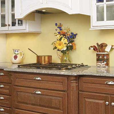 replacing the electric cooktop with a gas one required enlarging the silestone to accomodate it