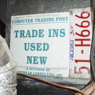 furnace patched with sign and old licence plate