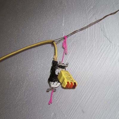 receptacle hanging by thread