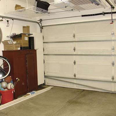 before photo of the garage that was converted into a rec room