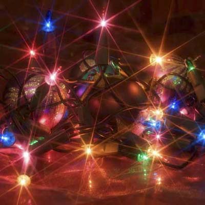 lit string of christmas lights in bright colors