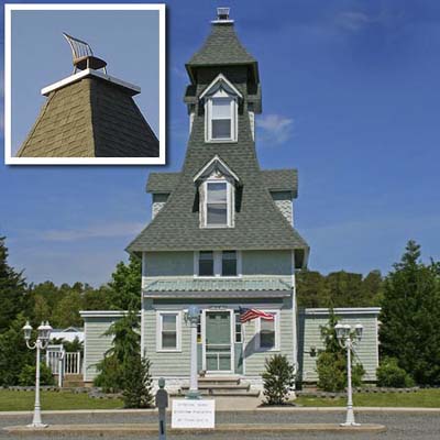 a Second Empire house in West Creek, NJ with a chair built onto the roof