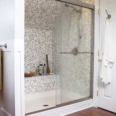 shower with mosaic tile in a remodeled attic
