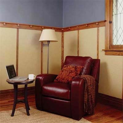 den featuring wainscoting with large flat panels