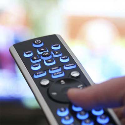 hand holding a remote control