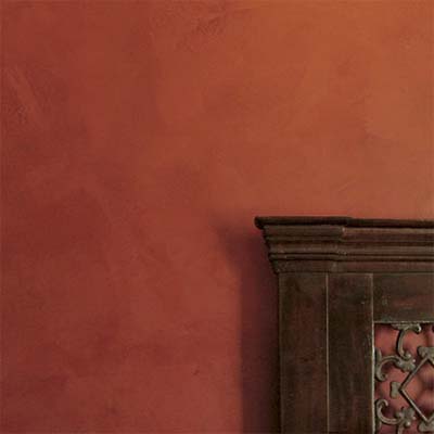example of plaster painting technique with rust colors applied in thick layers with a trowel or putty knife