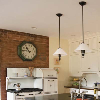 reproduction worktable task lights and an old train station clock