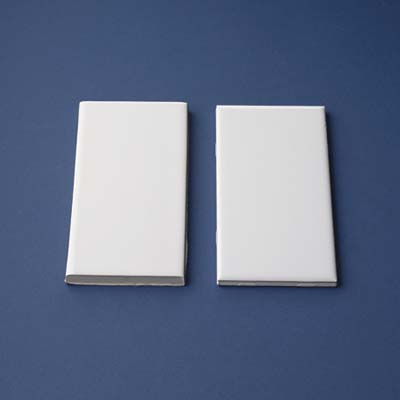 comparison of 2 pieces of subway tiles side-by-side