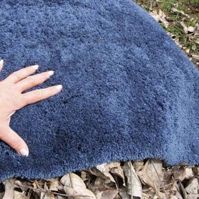 piece of carpet scrap used to insulate a compost pile from the cold
