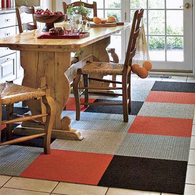 lovely kitchen with colorful geometric carpet beneath the table