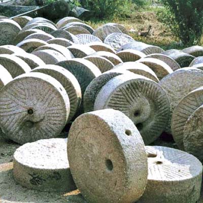 field of sandstone mill wheels available for use as garden ornaments, tabletops or more