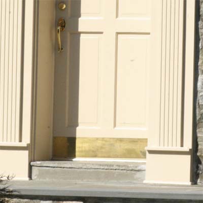 front doorway with brass kickplate