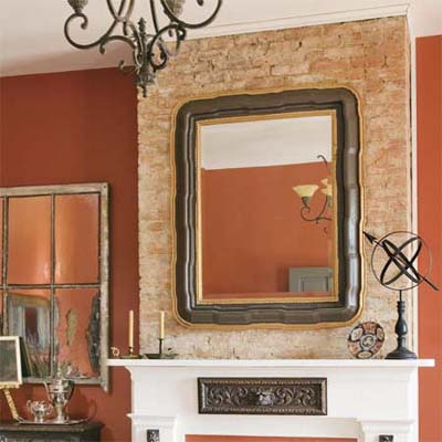 refinished glossy mirror frame hung in a room 
