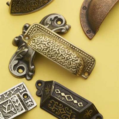 collection of antique looking bin pulls to be used as sash lifts