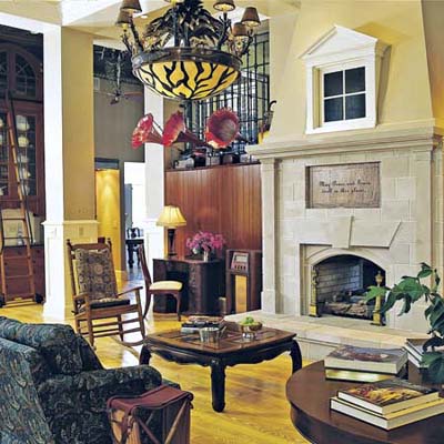 The limestone fireplace has iron grilles and large sized windows in former post office